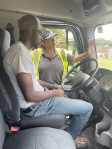 Instructor Kimberly Moser guides students on pre-trip inspections and safety considerations prior to conducting driving skills and maneuvers.